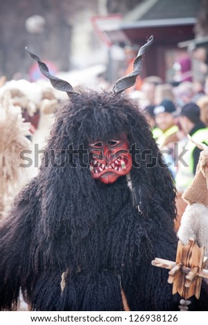 MOHACS, HUNGARY - MARCH 6: Unidentified people in mask participants at the Mohacsi Busojaras, it is a carnival for spring greetings) March 6, 2011 in Mohacs, Hungary.