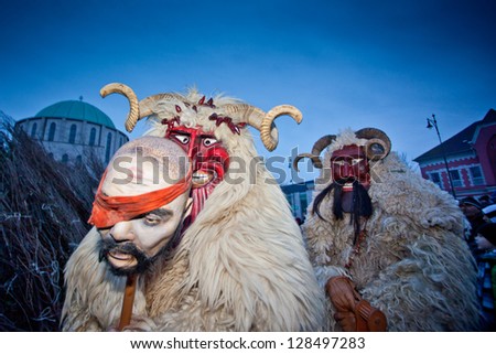 MOHACS, HUNGARY - FEBRUARY 12: Unidentified people in mask participants at the Mohacsi Busojaras, it is a carnival for spring greetings) February 12, 2013 in Mohacs, Hungary.