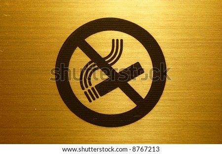 gold no smoking table in a hotel
