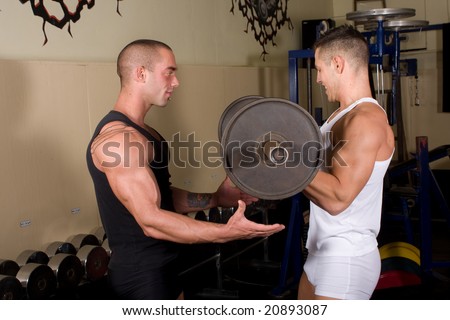 Two Bodybuilders training in the gym together