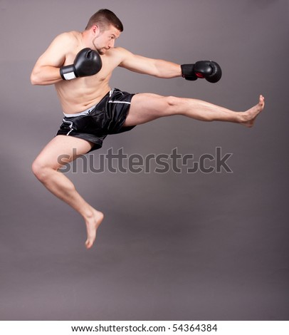 kick-boxer training flying kick before fight