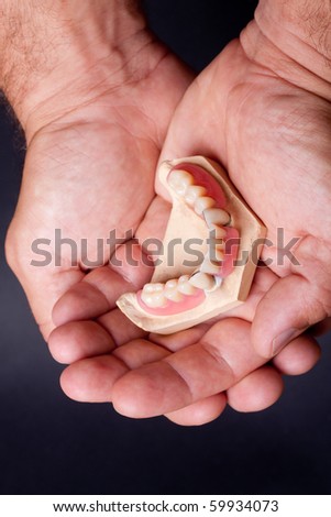 detail dental wax model in human palm
