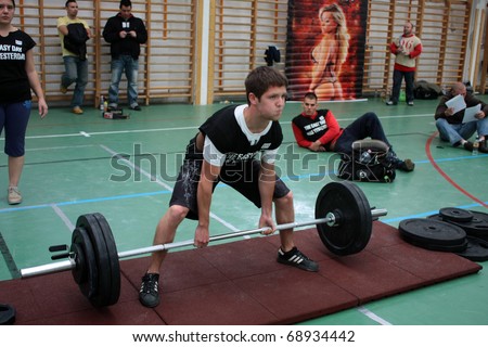PECS - OCTOBER 16: Unknown kid participates in Brutal Challenge power lifting championship October 16, 2010 in Pecs, Hungary.