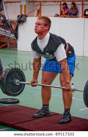 PECS, HUNGARY - OCTOBER 16: Unidentified man participates in Brutal Challenge power lifting championship October 16, 2010 in Pecs, Hungary.
