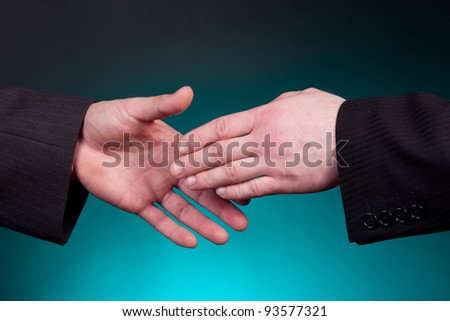 two elegant businessman shaking hands