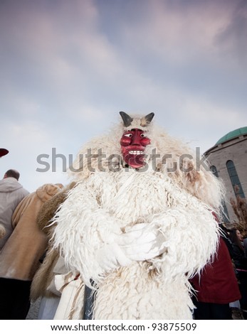 MOHACS, HUNGARY - MARCH 6: Unidentified person in mask participates at the Mohacsi Busojaras, it is a carnival for spring greetings on March 6, 2011 in Mohacs, Hungary.