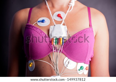 Young woman wearing a Holter Heart Monitor