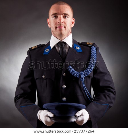 elegant soldier wearing uniform in studio