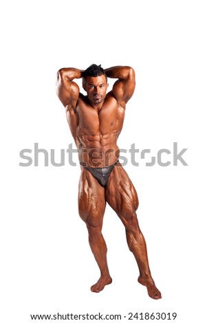 bodybuilder flexing his muscles in studio