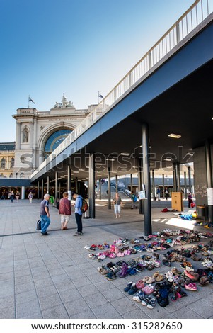 BUDAPEST - SEPTEMBER 7: child shoes for war refugees at Keleti Railway Station on 7 September 2015 in Budapest, Hungary. Refugees are arriving constantly to Hungary on the way to Germany.