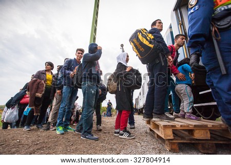 GYEKENYES- OCTOBER 6 : War refugees at the Gyekenyes Zakany Railway Station on 6 October 2015 in Gyekenyes, Hungary. Refugees are arriving constantly to Hungary on the way to Germany.