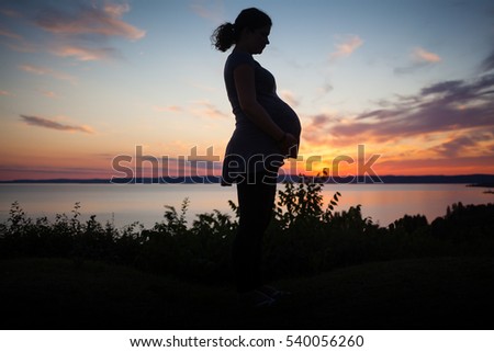 pregnant woman in sunset