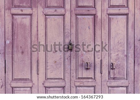 Old Wooden Purple Door With Padlock