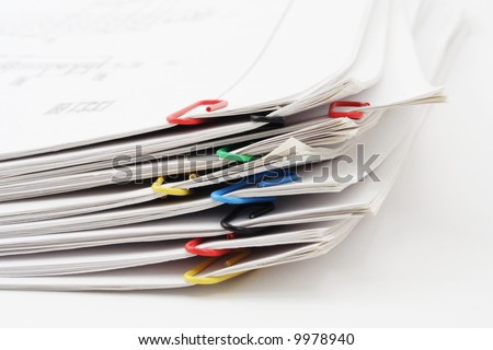 Pile of sheets of paper fastened by paper clips