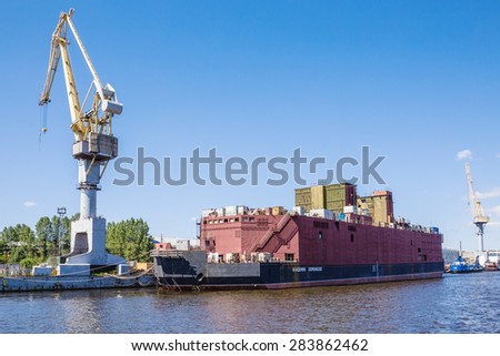 SAINT-PETERSBURG, RUSSIA - JUNE 15, 2014: Construction of the Floating power unit of nuclear thermal power plant Academician Lomonosov on the embankment of Baltisky Zavod Shipyard, St. Petersburg