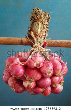 basket of onion on bamboo bar