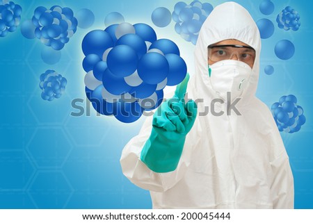 scientist in safety suit pointing to pile of molecular