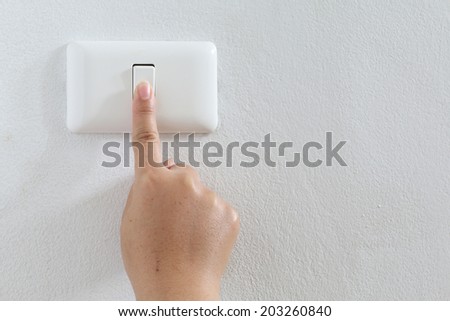 closeup finger press turn on/off electric-switch