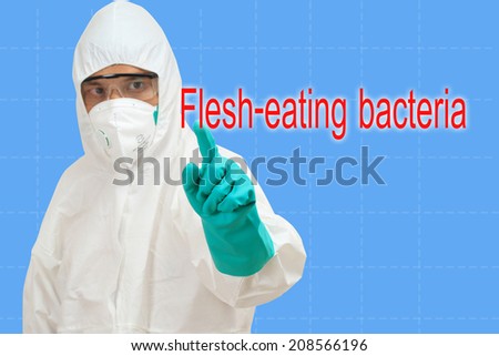scientist in safety suit pointing to word flesh-eating bacteria