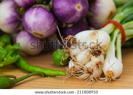 closeup spring onion and vegetable in kitchen