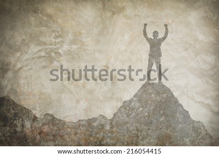 drawing of businessman hold up hands on the peak of mountain on concrete wall,success concept