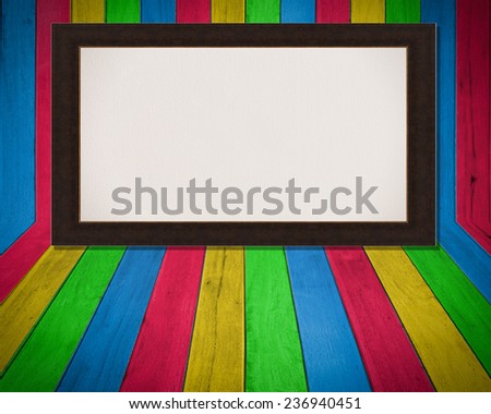 brown frame with canvas on wooden plank background