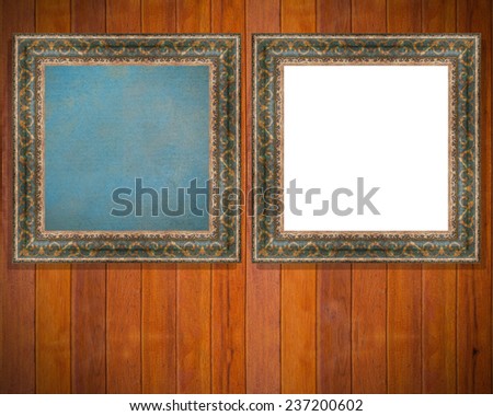 two vintage frame with canvas on wooden plank background