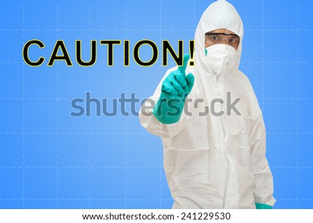 scientist in safety suit pointing to word caution