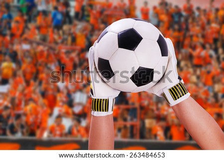 closeup goalkeeper super save on orange supporter