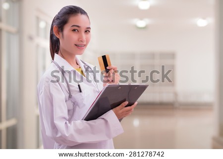 woman doctor holding card in hospital