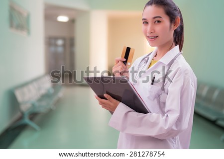 woman doctor holding card in hospital