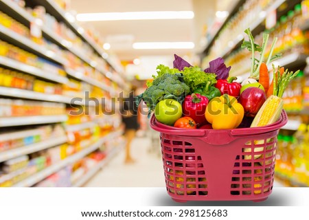fruit and vegetable in shopping basket sits on the counter in the supermarket.