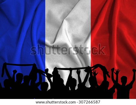 Silhouettes of soccer supporters on france flag background