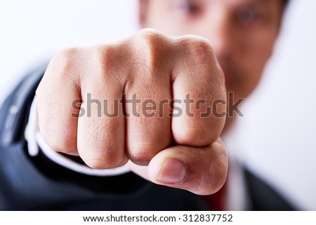 businessman punching the air,competition concept