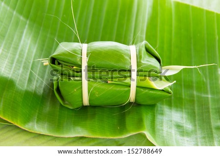 Glutinous rice steamed in banana leaf(Khao Tom Mat or Khao Tom Pad)bananas and sticky rice inside