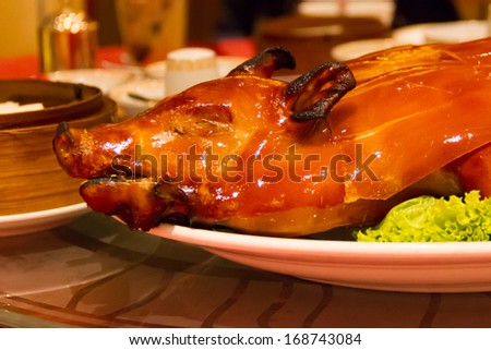 barbecued suckling pig on white background