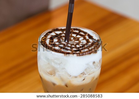 a cup of iced mocha on wooden table