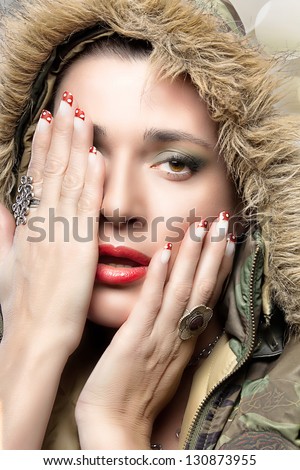 Beauty Hip Hop Woman in Camouflage Hoodie. Winter season