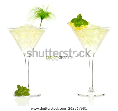 Two iced refreshing lemon granita cocktails garnished with fresh mint and lemon in a long stemmed martini glasses conceptual of a tropical vacation or celebration, isolated on white with sample text