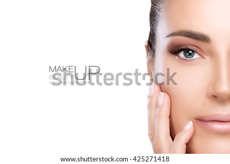 Beauty Makeup and Nail Art Concept. Beautiful fashion model woman with soft smoky eye makeup, foundation on a unblemished skin and trendy nude lipstick to match her manicured nails, half face isolated