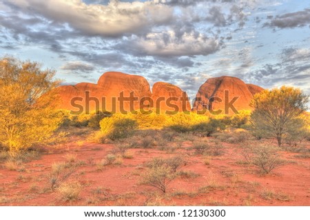 The sun sets in the Simpson desert on Kata Tjuta (The Olgas), Australia