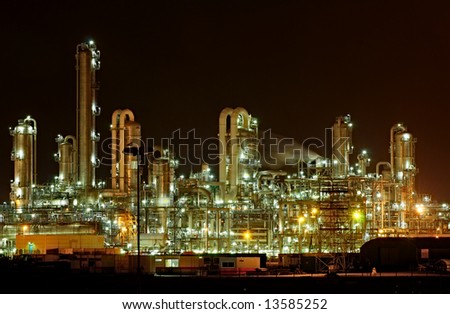 Towers and pipes of a chemical production facility at night