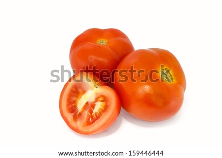 Fresh tomatoes and slices isolated on white background.