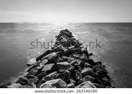 Black and white rock seascape by the beach