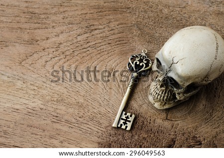 skull and key on a wood