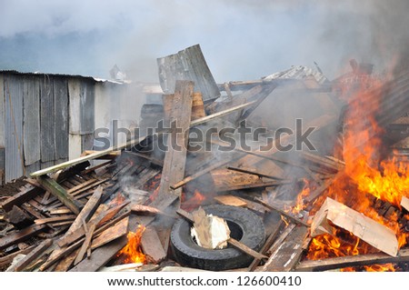 Burning a demolishing building