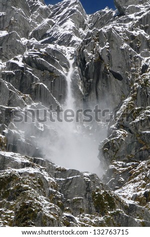 An alpine waterfall in the Southern Alps, South Island, New Zealand.