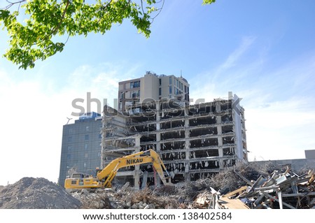 CHRISTCHURCH, NEW ZEALAND, NOVEMBER 16:  An excavator continues demolitions in earthquake ridden Christchurch, New Zealand  on 16-11-2012. 182 people died in the 6.4 earthquake the previous year.