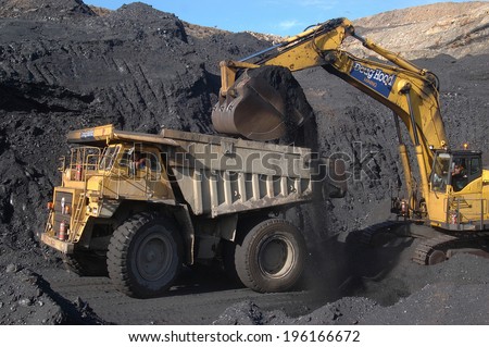 WESTPORT, NEW ZEALAND, CIRCA 2007: Digger loads up a truck with high grade coal at Stockton Coal Mine, West Coast, South Island, New Zealand