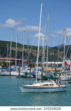 NELSON, NEW ZEALAND, DECEMBER 23, 2014: An unidentified man takes his sail boat from the Nelson marina in New Zealand on December 23, 2014